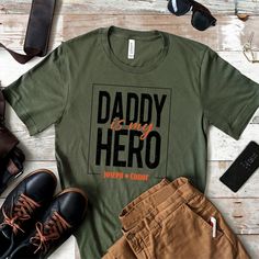 Celebrate the special bond with our "Daddy is My Hero" T-shirt! Perfect for Father's Day, birthdays, or just because. This bold and stylish design is sure to make any dad feels appreciated.  👕 Soft, high-quality fabric  🌟 Comfortable fit for all-day wear  🎨 Professionally printed design  📏 Available in multiple sizes  🎁 Ideal gift for any father figure  Show your love and admiration with a shirt that says it all! Product Features: Fabrication: Medium fabric (6.1 oz/yd² (206.8 g/m. Garment-dyed fabric. 100% ring-spun cotton Fit: Relaxed fit Sizing: Unisex Sizing Label: Sewn-in twill label Parents Christmas, Christmas Gifts For Parents, Papa Shirts, Feeling Appreciated, Christmas Gift For Dad, Father Figure, Gift For Dad, Dad To Be Shirts, My Hero