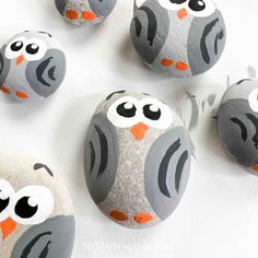 painted rocks with owls on them sitting next to each other