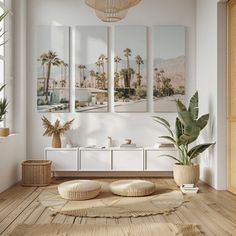 a living room with white walls and wooden flooring, palm trees in the background