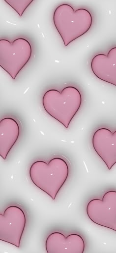 many pink hearts are arranged on a white background