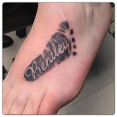 a foot tattoo with the word berkley written in cursive ink