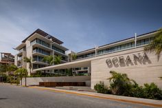 a large building with the word obama written on it's side in front of palm trees