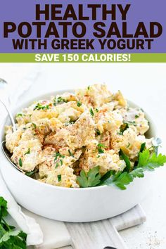 healthy potato salad with greek yogurt and parsley in a white serving bowl