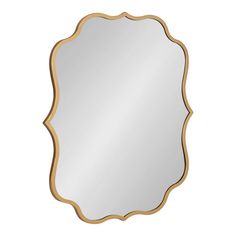 a gold framed mirror with an ornate design on the front and bottom edge, against a white background