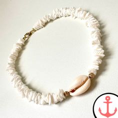 White Surf Necklace: Ride the Waves with Style Indulge your passion for the sea with our exquisite White Surf Necklace. Designed for the avid sea lover, this necklace is a stunning addition to our Surfer Necklace collection, capturing the essence of the ocean in its intricate design. Features of White Surf Necklace based on the Product Content High-Quality Materials: The White Surf Necklace is crafted with precision using premium materials, ensuring durability and long-lasting beauty. Elegant De White Shell-shaped Necklace For Gift, White Shell-shaped Necklace For A Gift, Adjustable White Shell Necklace Coastal Style, Adjustable White Shell Necklace In Coastal Style, White Strand Jewelry Gift, White Strand Jewelry As Gift, Ocean-inspired White Jewelry For Beach, Ocean-inspired White Beach Jewelry, Coastal Style White Adjustable Necklace