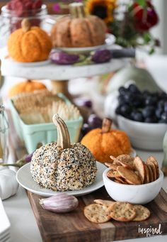 a table topped with plates and bowls filled with different types of food next to each other