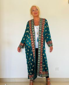 A Unique and Beautiful Kimono Duster Jacket. Loose and Floaty,Glittering Gold Sequins;Perfect to Dress Up or Down for Holidays and Parties. This has been Handmade from a Vintage Indian Sari,so is completely Original and Sustainable. A Wonderfully Chic and Flattering Turquoise and Wine Silky Chiffon. The Gorgeous design has Lovely Gold Embellishment allover , Glittering with 1000's of Sparkling Sequins,Beads and Diamantes. This Stunning full length Jacket drapes elegantly,with long sleeves ,and i Party Jacket, Beautiful Kimono, Unique Jackets, Party Jackets, Kimono Duster, Embellished Jacket, Duster Jacket, Beautiful Kimonos, Gold Embellishment