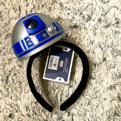 a headband with a star wars r2d2 helmet on top of it