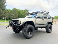 a white jeep parked in a parking lot