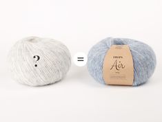 two balls of yarn with question marks on the top and bottom, one blue and white