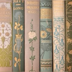 an assortment of books lined up on a shelf