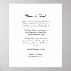 a white card with the words man and dad written in black on it, next to a vase filled with flowers