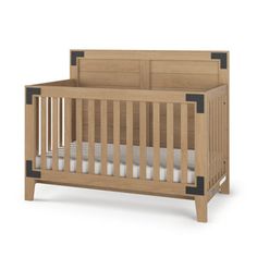 a wooden crib with white sheets on the bottom and black trim around the sides