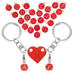 two key chains with letters and a heart