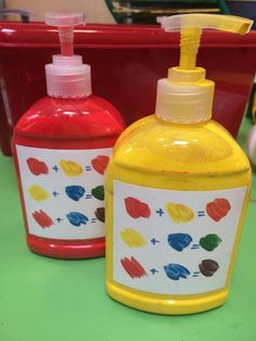 two hand soaps are sitting next to each other on a table with red and yellow containers