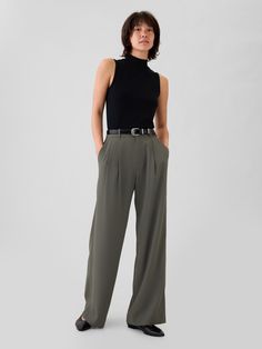 Soft woven trousers.  E-waist with concealed hook and bar closure, zip fly.  Front slant pockets, back welt pockets.  Pleating at front.  * Fit: Classic.  An easy silhouette that fits close  at the waist, and is relaxed through the hips and thigh.  Models wearing Gap Pleated Dress Pants, Rehearsal Dinner Outfits, Easy Silhouette, Pleated Trousers, Swimwear Dress, Dinner Outfits, Pleated Pants, T Shirt Vest, The Gap