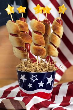 hotdogs on sticks in a patriotic cup