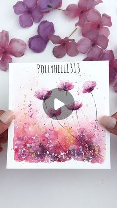 someone holding up a card with flowers on it and the words polyhil 13 in front of them