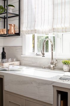 Dakar Quartzite on backsplash, counters, and farmhouse sink design in kitchen. Dakar Quartzite Countertops, Quartzite Arizona, Quartzite Kitchen Countertops, Stone Farmhouse Sink, White Quartzite Countertops, White Quartzite