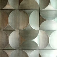 an abstract wall made up of metal circles