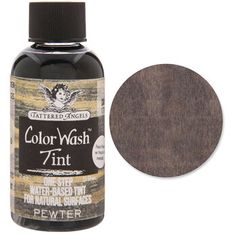 a bottle of color wash paint next to a white background