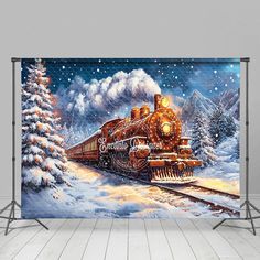 a christmas train is coming down the tracks in front of snow covered trees and evergreens