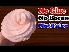 a hand holding a pink ball of yarn with the words no glue, no borax, not fake