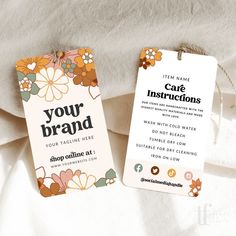 two tags with the words your brand on them sitting next to each other in front of a white sheet