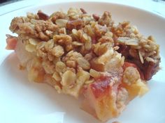 a close up of a plate of food with fruit and nuts on the top of it