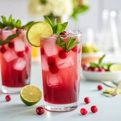 two glasses filled with cranberry lemonade and lime