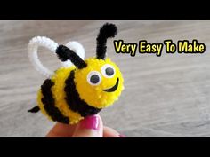 a small yellow and black stuffed animal with the words very easy to make on it