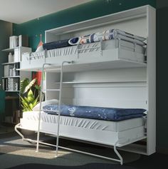 a bunk bed with two sets of mattresses on top of it in a room