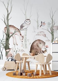 a children's room with an animal mural and wooden chairs in front of it