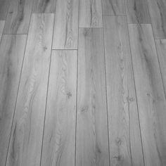 an image of wood flooring that looks like it has been painted grey and white