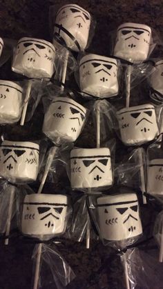 star wars themed cake pops are wrapped in plastic and ready to be used as desserts