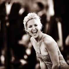 black and white photograph of a woman laughing