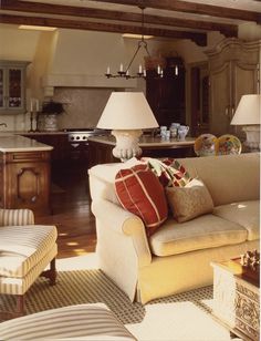 a living room filled with furniture and lamps