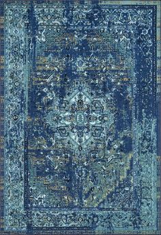 a blue rug with an ornate design on the top and bottom, in various colors