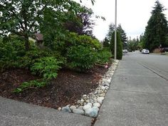 there is a rock garden on the side of the road