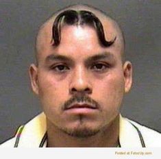 a man with a moustache on his head is shown in this mug shot