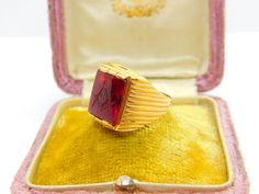 Details: A fantastic and wonderfully designed antique Victorian 18ct yellow gold large signet ring set with a stunning carved natural ruby intaglio depicting a masonic compass crest, the ruby approximately 6ct and with beautiful colour c1860. The gold has been XRF tested as there are no hallmarks and the stone has been machine tested. A stunning example. This is a wonderful item that would make a perfect gift or addition to any collection. The BOX pictured is for PRESENTATION ONLY and is NOT inc Elegant Red Intaglio Signet Ring, Victorian Gold Signet Ring With Gemstone, Antique Gold Signet Ring With Gemstone, Yellow Gold Ruby Signet Ring Hallmarked, Formal Carved Yellow Gold Signet Ring, Antique Carved Signet Ring For Formal Occasions, Antique Yellow Gold Signet Ring With Gemstone, Antique Carved Yellow Gold Signet Ring, Vintage Carved Signet Ring For Formal Occasions