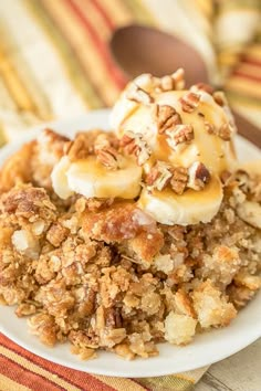 a close up of a plate of food with bananas and granola on the side