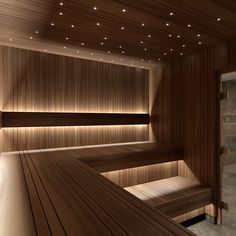 a wooden sauna with lights on the ceiling