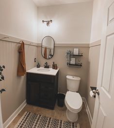 Bathroom with bead board wall trim and peg wall Bathroom Painting Ideas Beadboard, Bathroom Half Panel Wall, Update Beadboard Paneling, Beige Beadboard Bathroom, Bead Board Small Bathroom, Tan Beadboard Bathroom, Bean Board Walls, Bathroom Ideas Beadboard, Small Bathroom Beadboard Ideas