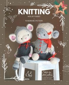 two knitted mice sitting on top of a white stool in front of a christmas card