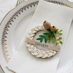 a white plate topped with a napkin ring