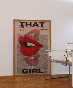 there is a poster with red lips on the wall next to a chair and table