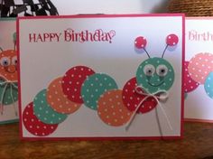 two cards with the words happy birthday and a caterpillar on them, sitting next to each other