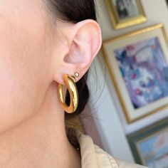 14KT yellow gold shiny-finish tube, round hoop earrings. Slightly tapered style tubes- chunkier by the earlobe and taper down the rest of the hoop. Brushed/matte finish on the inner side of the hoop. Modern, artistic touches to these hoops! Length: 32mm Width: 30mm Thickness: 7mm tapers to 3mm in back Weight: 8.20 grams per pair Stamped 14KT Latch back closure Hollow tubes, but very durable Made in Italy Medium Size, Pearl Earrings, Hoop Earrings, Yellow Gold, Italy, Yellow, Gold