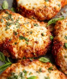 some meat patties with cheese and herbs on them are ready to be served in the oven